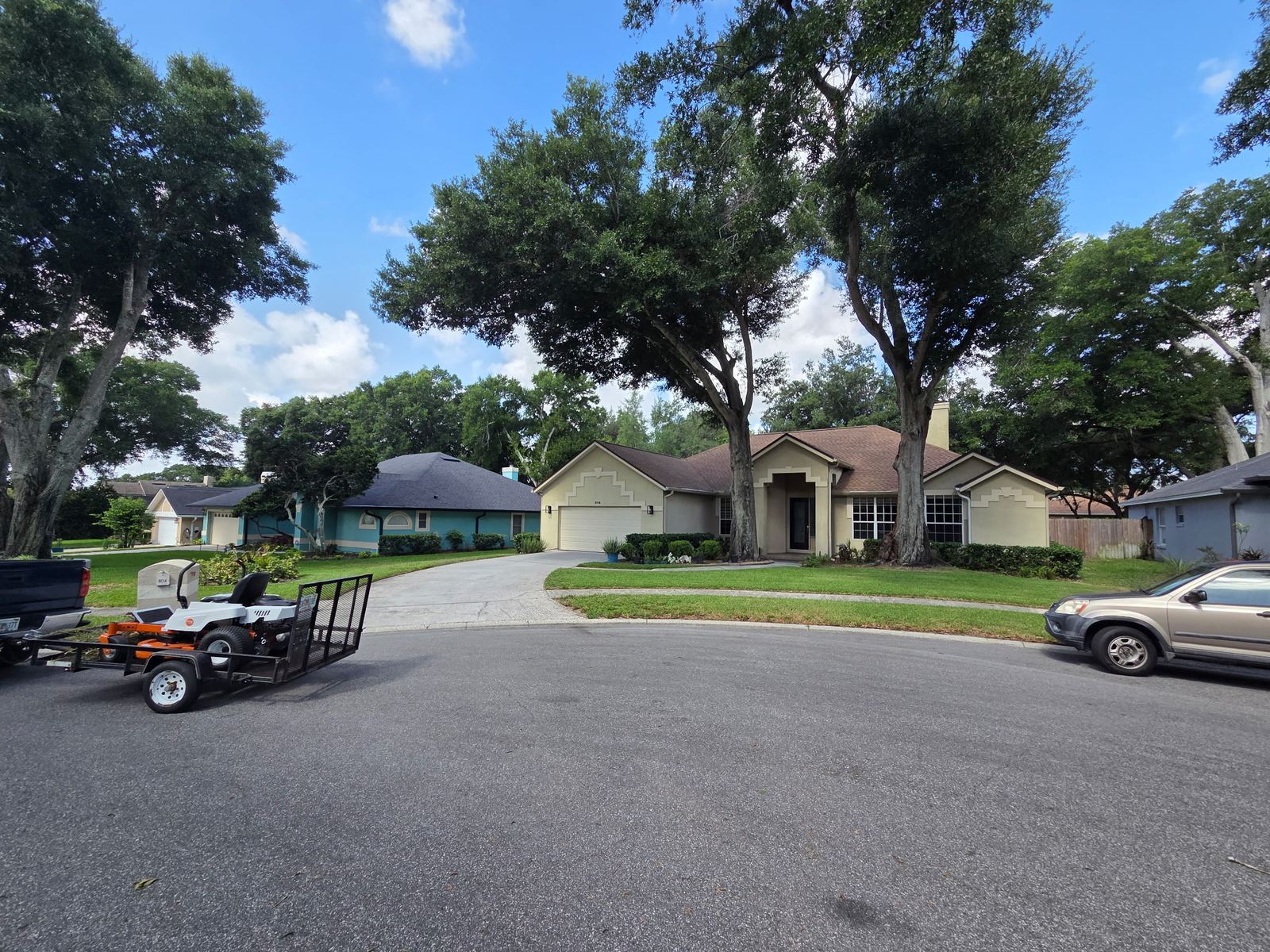 Freshly mowed front yard with sharp lines along the driveway